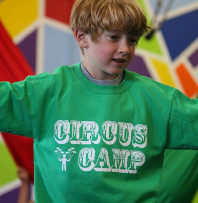 Kid in a "circus camp" t-shirt at SHOW Circus Studio in Easthampton, Massachusetts