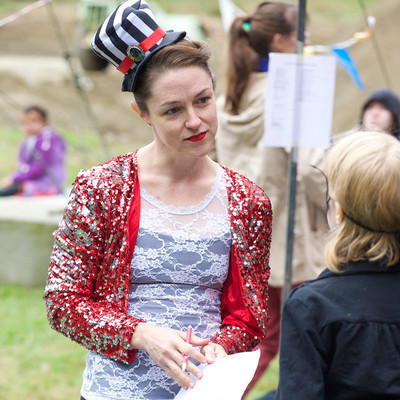 Performer from SHOW Circus Studio in Easthampton, Massachusetts, listening to a kid