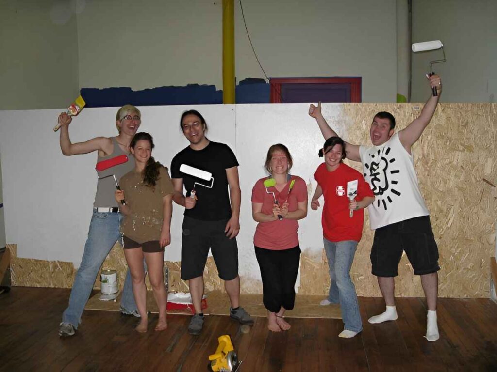 Happy painters in a historic photo at SHOW Circus Studio in Easthampton, Massachusetts.